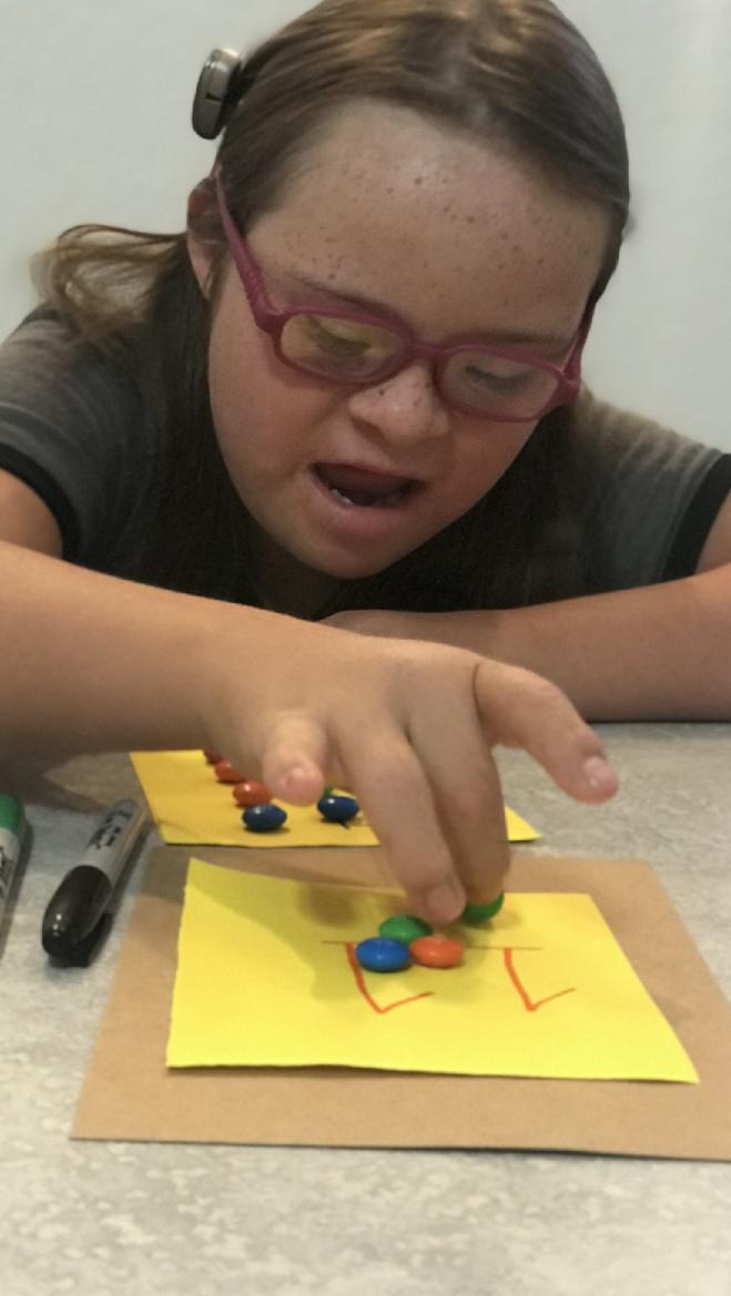 A child learning with candy