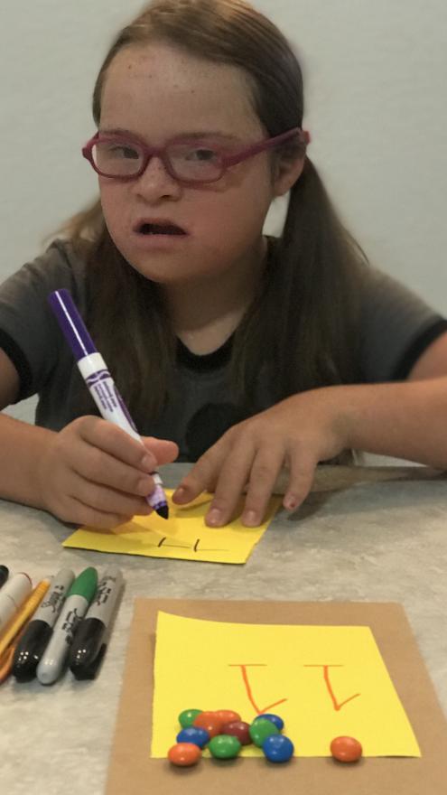 A child learning with candy