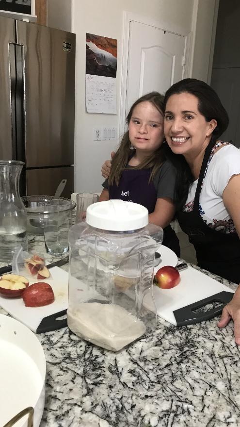 A child learning while cooking with Marlene